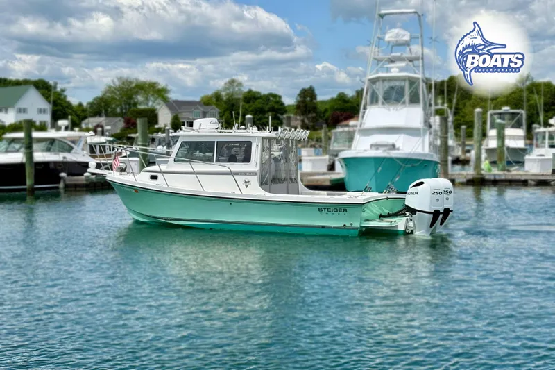 Slide: The Image of 2022 Steiger Craft 28 Miami boat docked in a marina, featuring dual Honda outboard engines. - 1