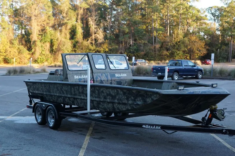 Slide: The Image of 2019 SeaArk Predator 220 AK SC boat on trailer in parking lot. - 10