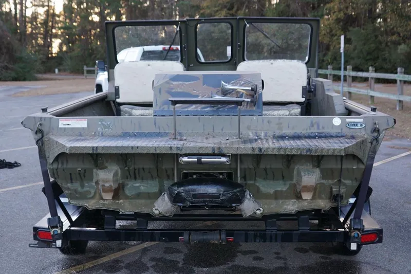Slide: The Image of 2019 SeaArk Predator 220 AK SC boat on trailer, rear view in parking lot. - 9