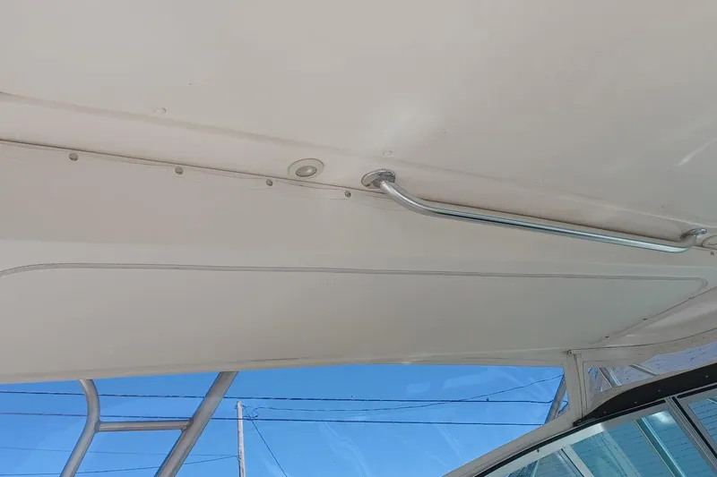 Slide: The Image of Interior view of a 2001 Pursuit 3400 Express boat with metal handrail. - 19