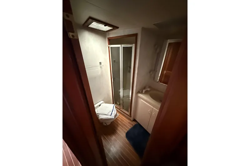 Slide: The Image of Bathroom interior of 1989 Viking 41 Convertible yacht with shower and sink. - 18