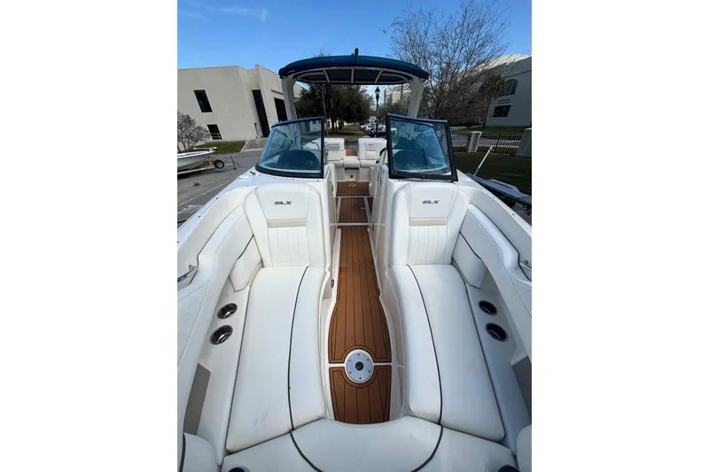 Slide: The Image of 2008 Sea Ray 270 Sundeck bow rider seating. table base, cup holders and hand rails looking aft - 23