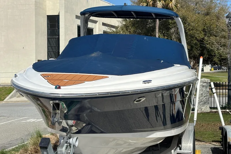 Slide: The Image of 2008 Sea Ray 270 Sundeck boat with blue cover on trailer. - 6