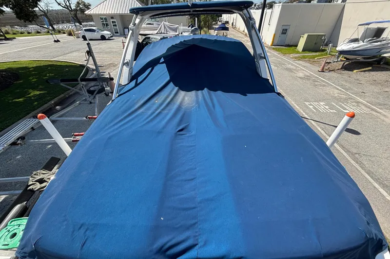 Slide: The Image of Covered 2008 Sea Ray 270 Sundeck boat on trailer in parking lot. - 7