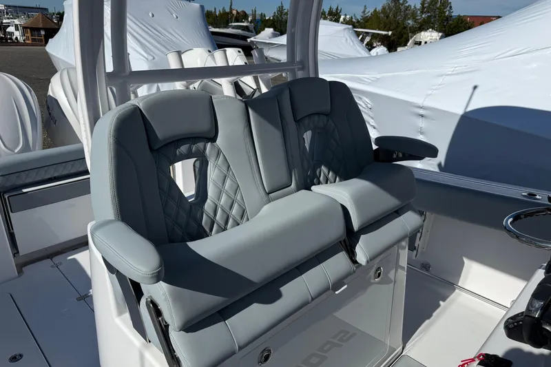 Slide: The Image of 2026 Sportsman Open 322 Center Console boat with luxurious seating and modern design. - 13