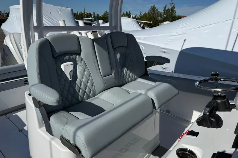 Slide: The Image of 2026 Sportsman Open 322 Center Console with luxurious seating and modern steering wheel. - 14