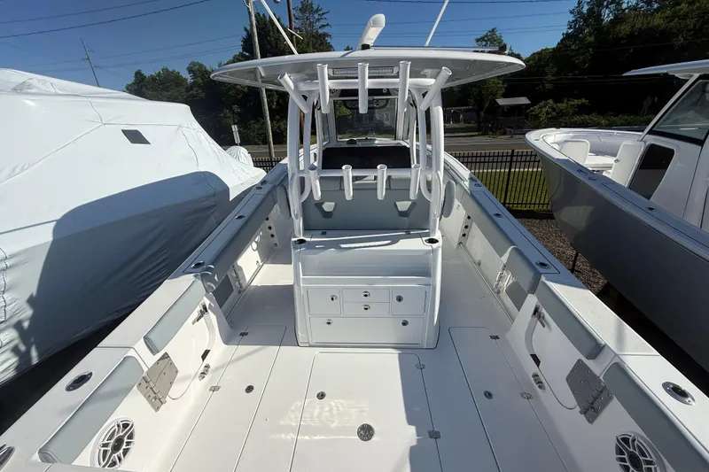 Slide: The Image of 2026 Sportsman Open 322 Center Console boat with spacious deck and modern design. - 18