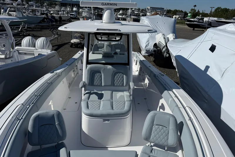 Slide: The Image of 2026 Sportsman Open 322 Center Console boat with sleek seating and advanced navigation system. - 3