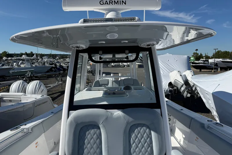 Slide: The Image of 2026 Sportsman Open 322 Center Console boat with advanced Garmin navigation system. - 7