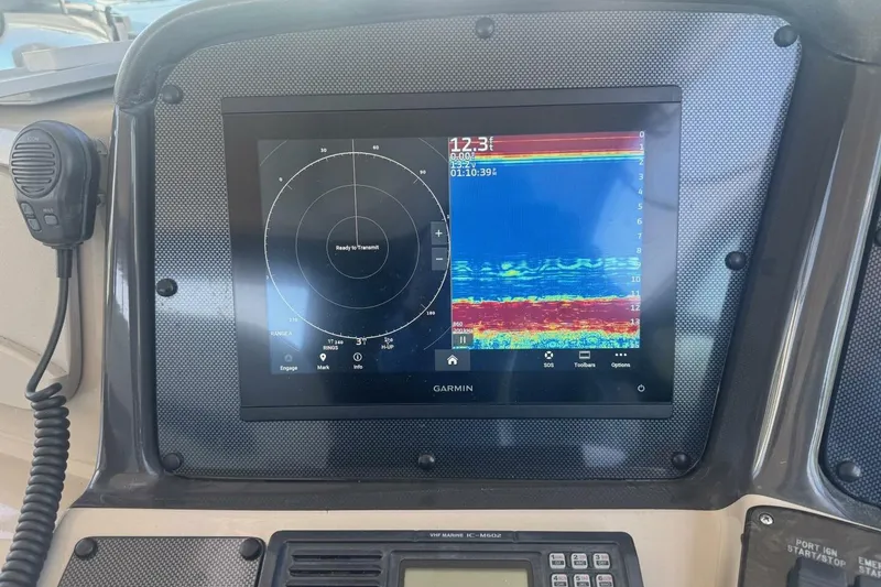Slide: The Image of Garmin marine display on 2005 Sea Ray 420 Sundancer dashboard with sonar and radar. - 4