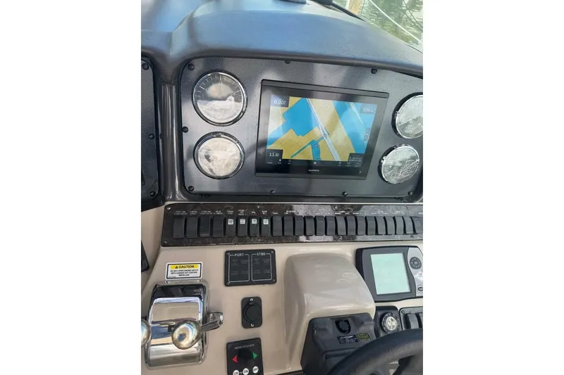 Slide: The Image of 2005 Sea Ray 420 Sundancer dashboard with navigation display and control panel. - 7