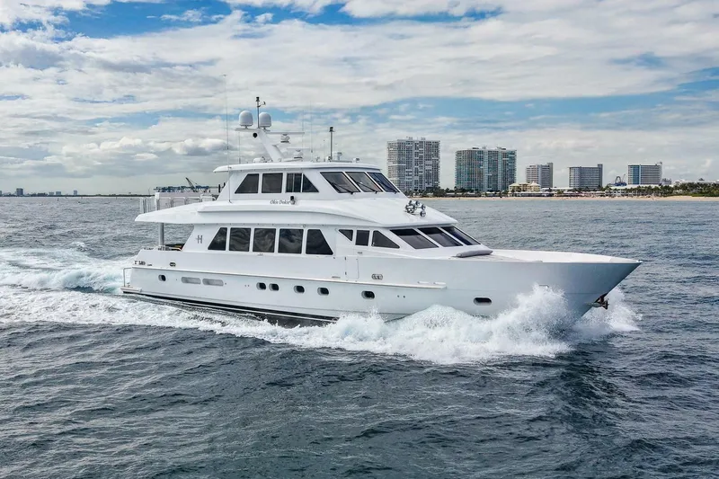 The Image of 2009 Hargrave Enclosed Bridge yacht cruising near a city skyline. - 1