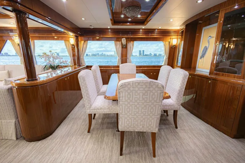 Slide: The Image of Luxurious dining area on 2009 Hargrave Enclosed Bridge yacht with elegant wood finishes. - 17