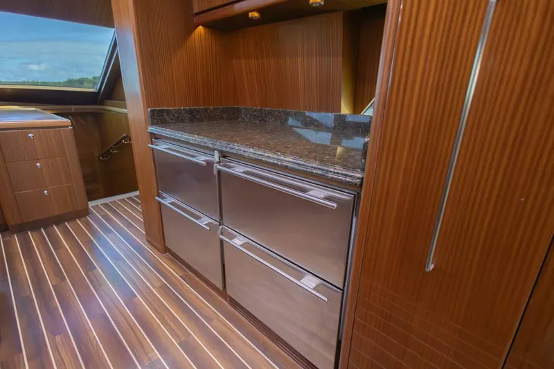 Slide: The Image of Luxurious 2009 Hargrave Enclosed Bridge yacht interior with wood paneling and modern cabinetry. - 23