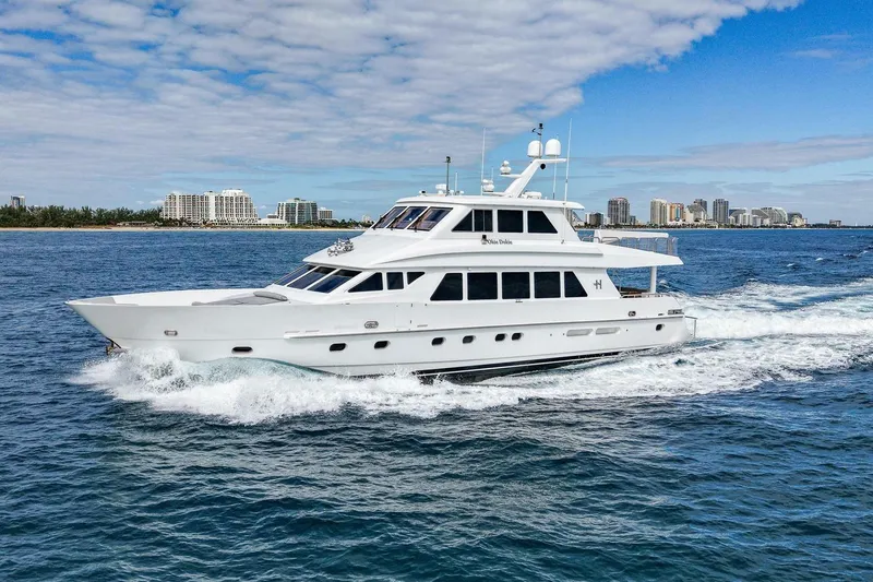 Slide: The Image of 2009 Hargrave Enclosed Bridge yacht cruising on blue ocean near city skyline. - 3