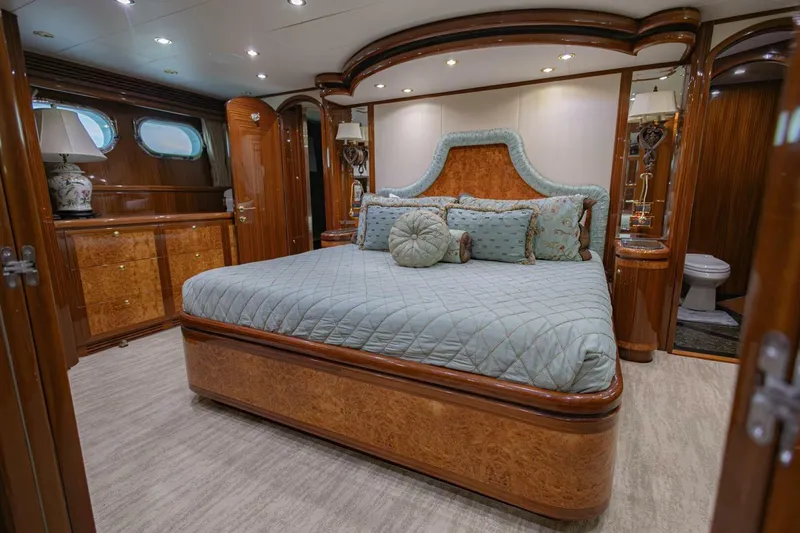 Slide: The Image of Luxurious bedroom interior of 2009 Hargrave Enclosed Bridge yacht with elegant wood finishes. - 31