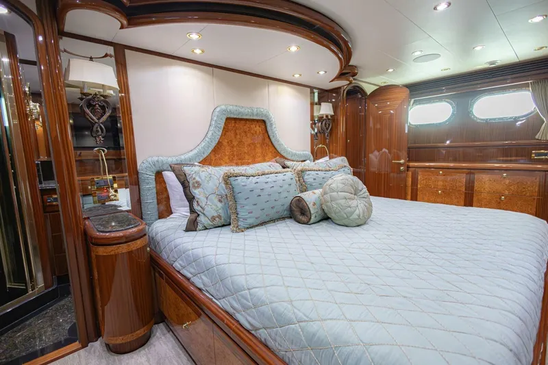 Slide: The Image of Luxurious bedroom interior of 2009 Hargrave Enclosed Bridge yacht with elegant wood finishes. - 33