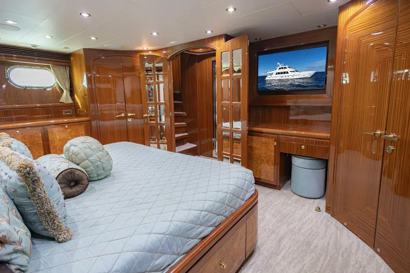 Slide: The Image of Luxurious 2009 Hargrave Enclosed Bridge yacht bedroom with elegant wood finishes and plush bedding. - 34