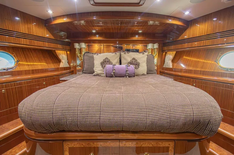 Slide: The Image of Luxurious 2009 Hargrave Enclosed Bridge yacht bedroom with elegant wood paneling and plush bedding. - 41