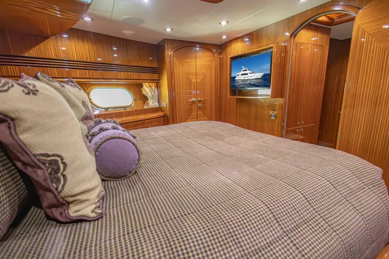 Slide: The Image of Luxurious 2009 Hargrave Enclosed Bridge yacht bedroom with elegant wood paneling and plush bedding. - 42