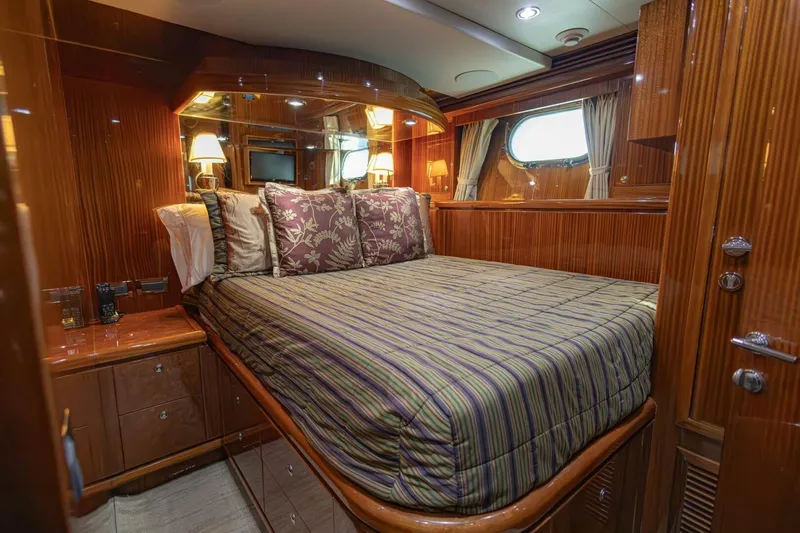 Slide: The Image of Luxurious bedroom interior of 2009 Hargrave Enclosed Bridge yacht with elegant wood finish. - 45