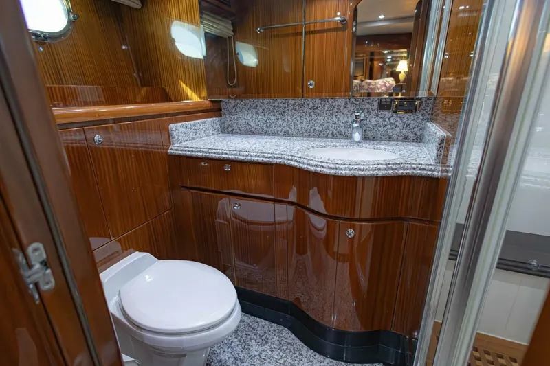 Slide: The Image of Luxurious 2009 Hargrave Enclosed Bridge yacht bathroom with wood paneling and granite countertop. - 47
