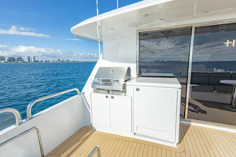 Slide: The Image of 2009 Hargrave Enclosed Bridge yacht deck with grill, ocean view, and city skyline. - 55