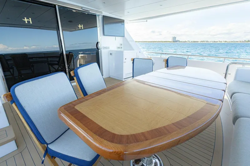 Slide: The Image of Luxurious 2009 Hargrave Enclosed Bridge yacht deck with elegant dining area and ocean view. - 64