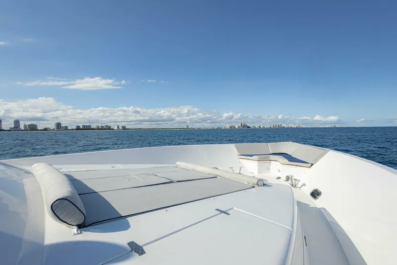 Slide: The Image of Bow view of 2009 Hargrave Enclosed Bridge yacht on open sea with city skyline. - 69