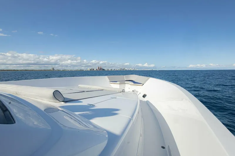 Slide: The Image of 2009 Hargrave Enclosed Bridge yacht cruising on open sea with city skyline in distance. - 75