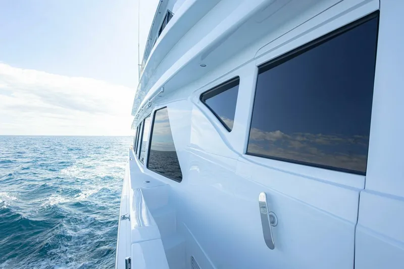Slide: The Image of 2009 Hargrave Enclosed Bridge yacht cruising on open sea under clear sky. - 76