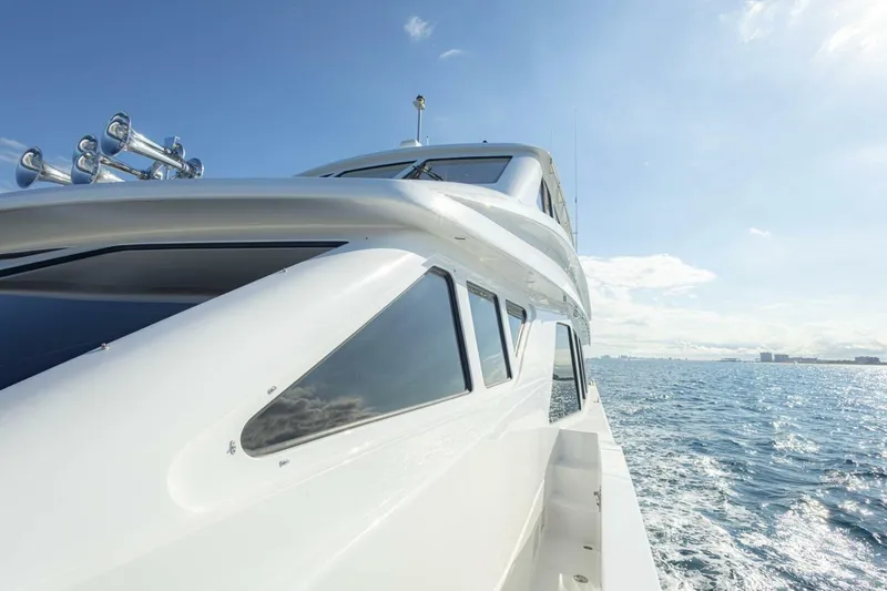 Slide: The Image of 2009 Hargrave Enclosed Bridge yacht cruising on open sea under clear blue sky. - 77