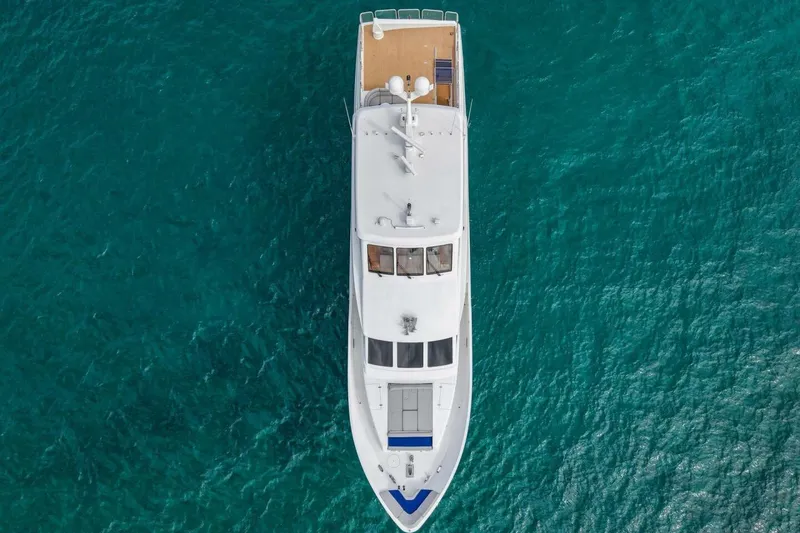 Slide: The Image of Aerial view of 2009 Hargrave Enclosed Bridge yacht on turquoise water. - 8
