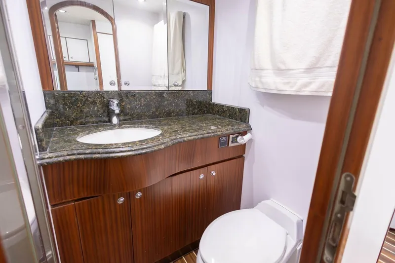 Slide: The Image of Luxurious bathroom in 2009 Hargrave Enclosed Bridge yacht with elegant wood cabinetry. - 81