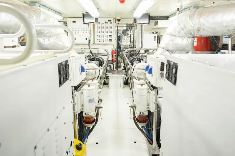 Slide: The Image of Engine room of 2009 Hargrave Enclosed Bridge yacht, featuring machinery and control panels. - 84