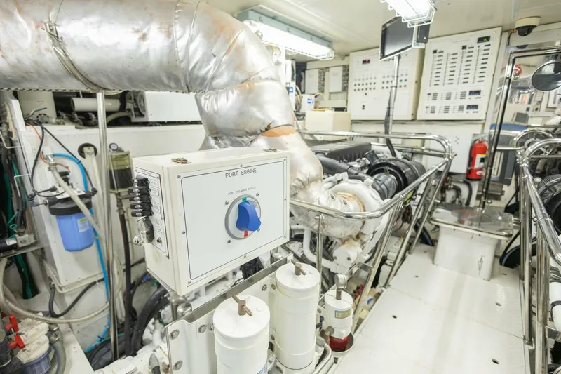 Slide: The Image of Engine room of 2009 Hargrave Enclosed Bridge yacht, featuring control panels and machinery. - 85