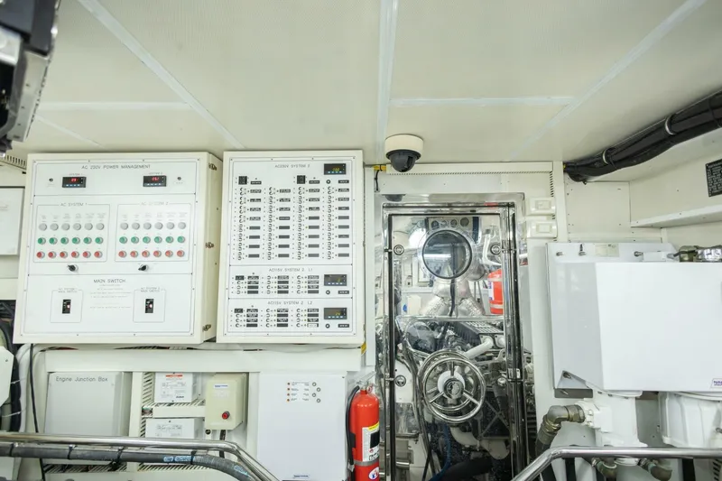 Slide: The Image of Engine room of 2009 Hargrave Enclosed Bridge yacht with control panels and equipment. - 87