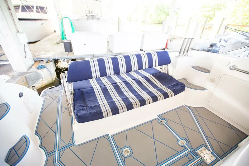 Slide: The Image of 2008 Regal 38 boat interior with striped seating and modern flooring. - 18