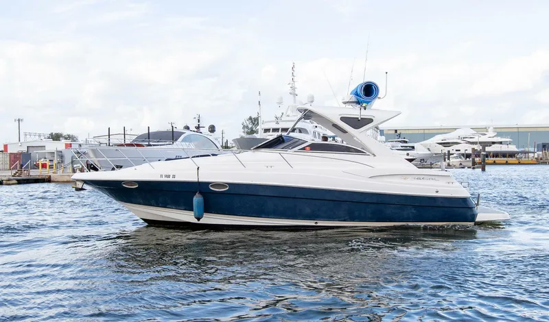 Slide: The Image of 2008 Regal 38 yacht on water, featuring sleek design and modern amenities. - 3