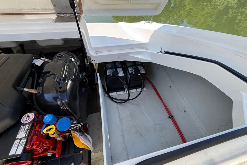 Slide: The Image of 2018 Cobalt CS22 boat engine compartment with batteries and wiring. - 6