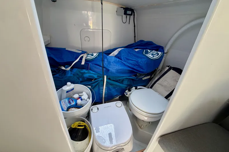 Slide: The Image of Interior of 2020 Jeanneau Sun Fast 3300 sailboat with storage and marine toilet. - 54