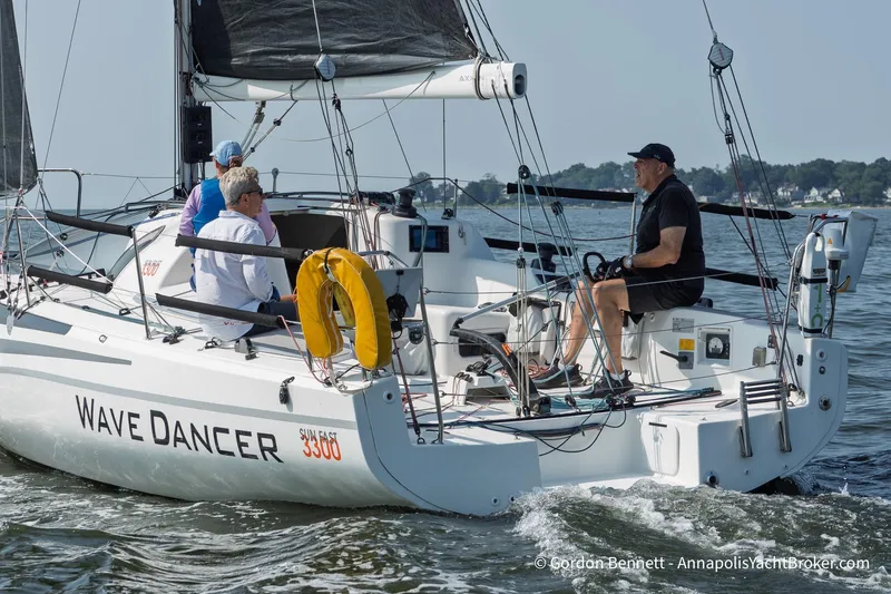 Slide: The Image of 2020 Jeanneau Sun Fast 3300 "Wave Dancer" sailing with crew on calm waters. - 6