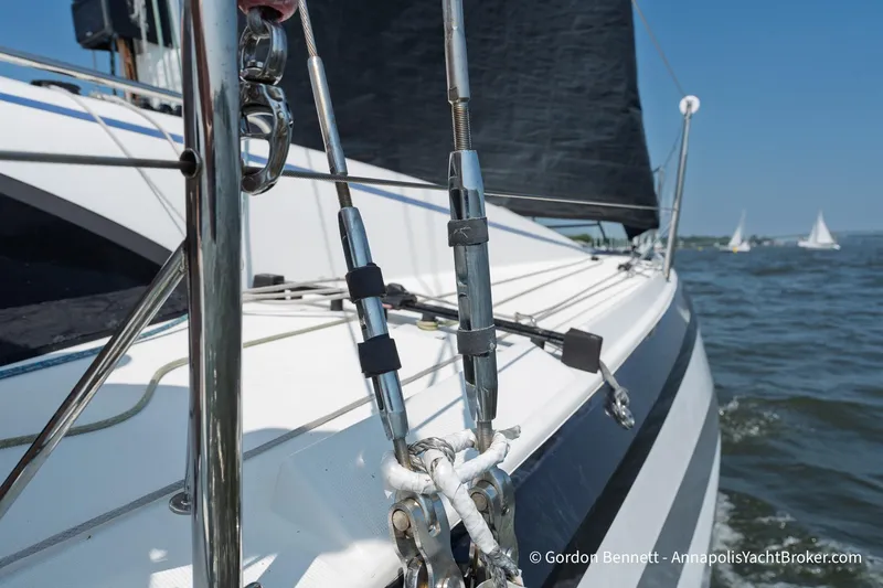 Slide: The Image of 2020 Jeanneau Sun Fast 3300 sailboat on water, showcasing rigging and sleek design. - 22