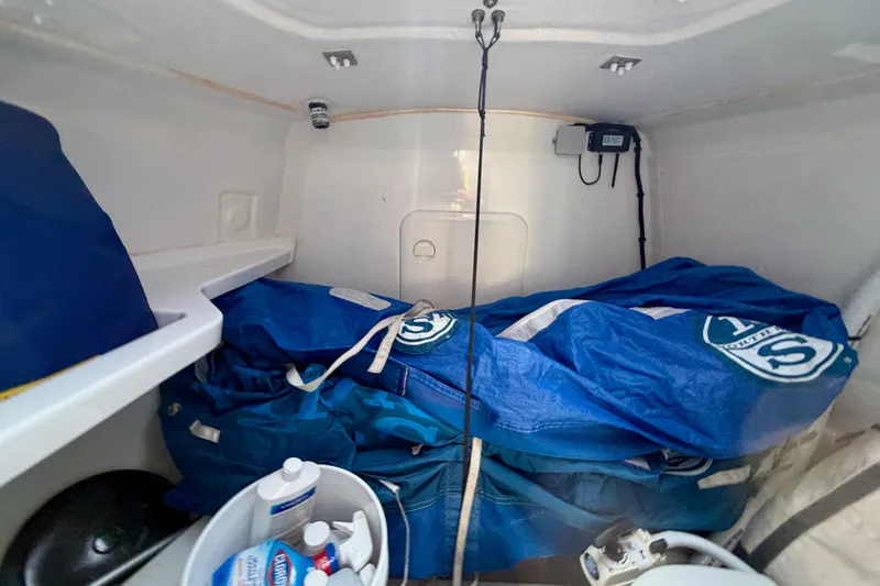 Slide: The Image of Interior storage of 2020 Jeanneau Sun Fast 3300 sailboat with blue sails and equipment. - 43