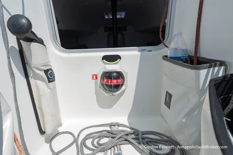 Slide: The Image of Interior view of a 2020 Jeanneau Sun Fast 3300 sailboat cockpit with compass and ropes. - 37