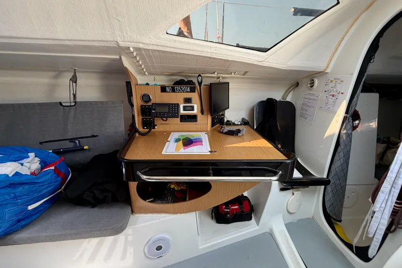 Slide: The Image of Navigation station inside a 2020 Jeanneau Sun Fast 3300 sailboat, featuring communication equipment. - 51
