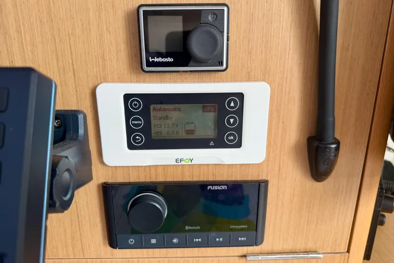 Slide: The Image of Control panel on 2020 Jeanneau Sun Fast 3300 yacht, featuring EFOY and Fusion systems. - 58
