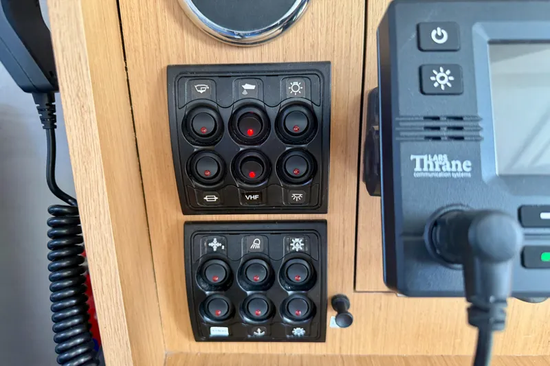 Slide: The Image of Control panel of a 2020 Jeanneau Sun Fast 3300 sailboat with communication system. - 57