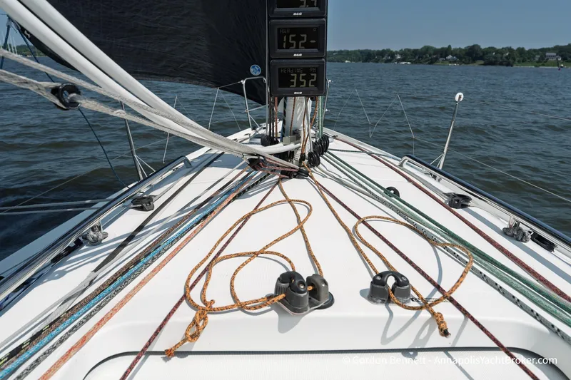 Slide: The Image of 2020 Jeanneau Sun Fast 3300 sailboat deck with ropes and instruments on a sunny day. - 20