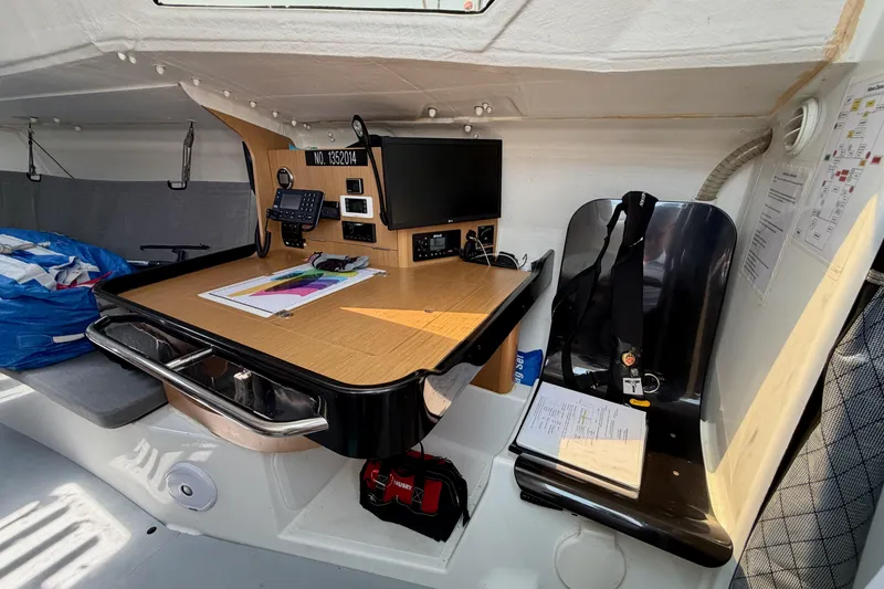 Slide: The Image of Interior of 2020 Jeanneau Sun Fast 3300 sailboat with navigation station and equipment. - 48